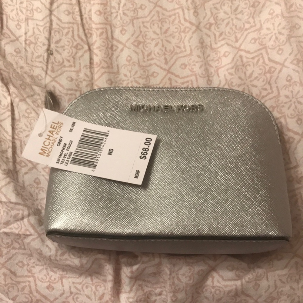 Make up case by Michael Kors in sliver.